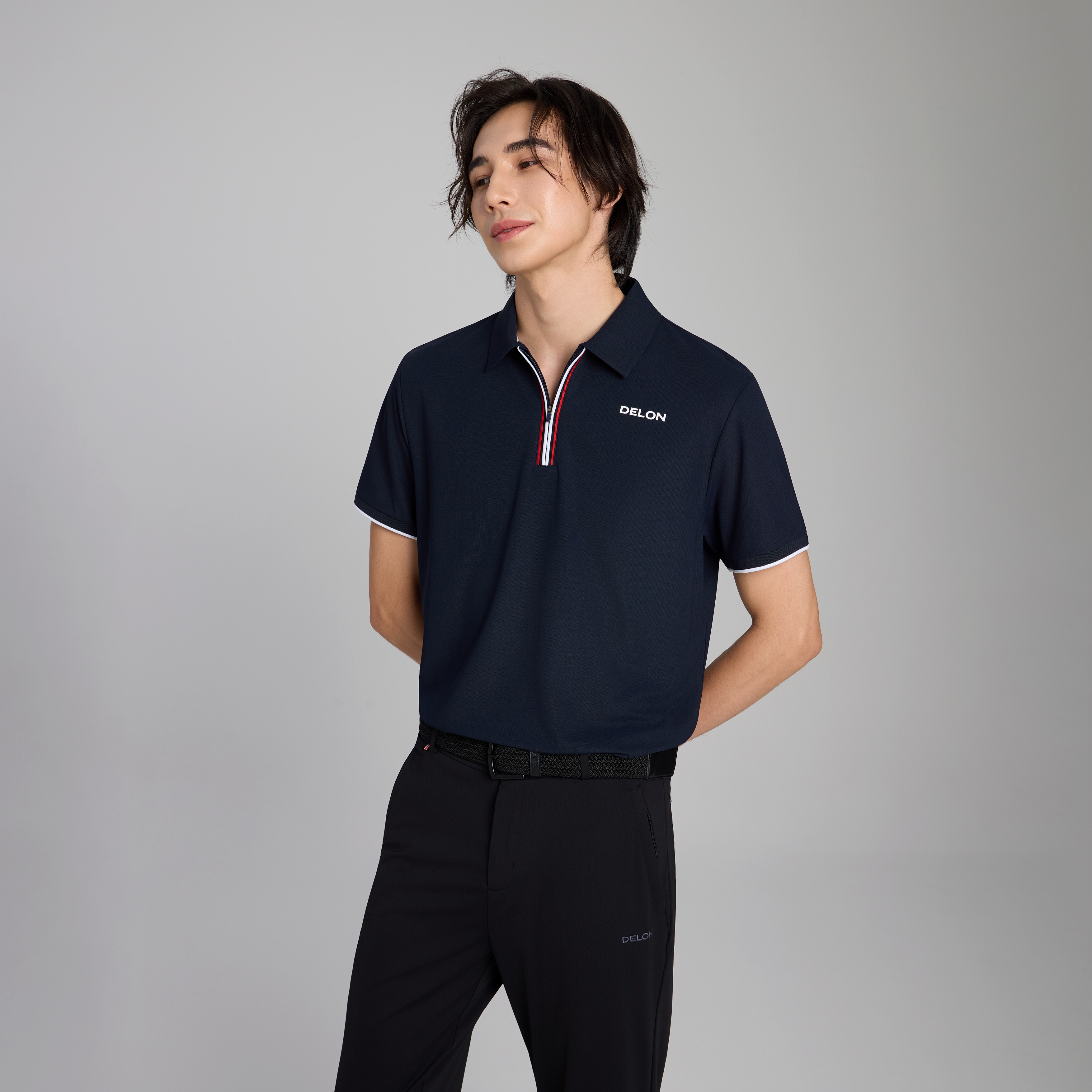 DELON Men's Dynamic Zipper Performance Polo in Navy Blue, featuring a modern quarter-zip placket and premium dual-colored piping.